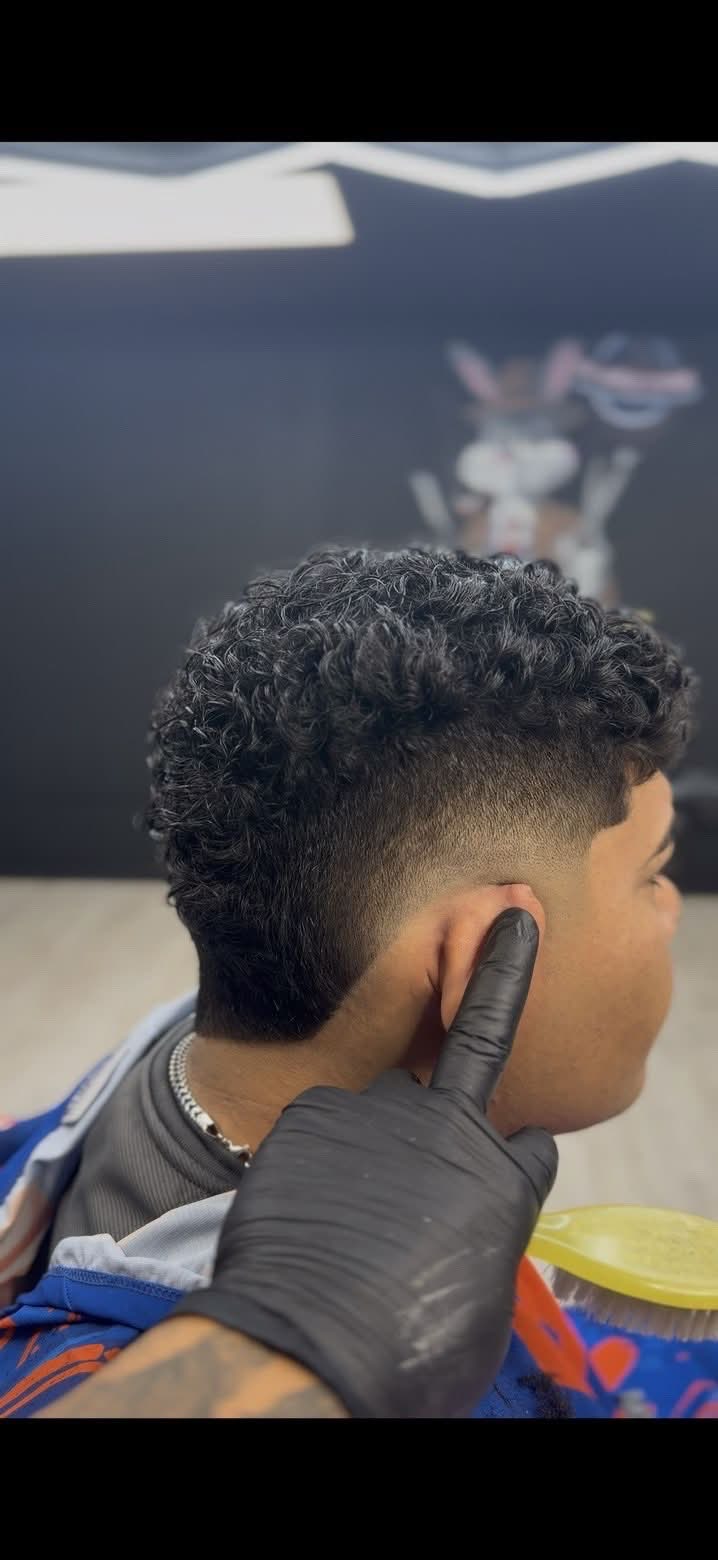 Curly taper fade at Masters of da Fade