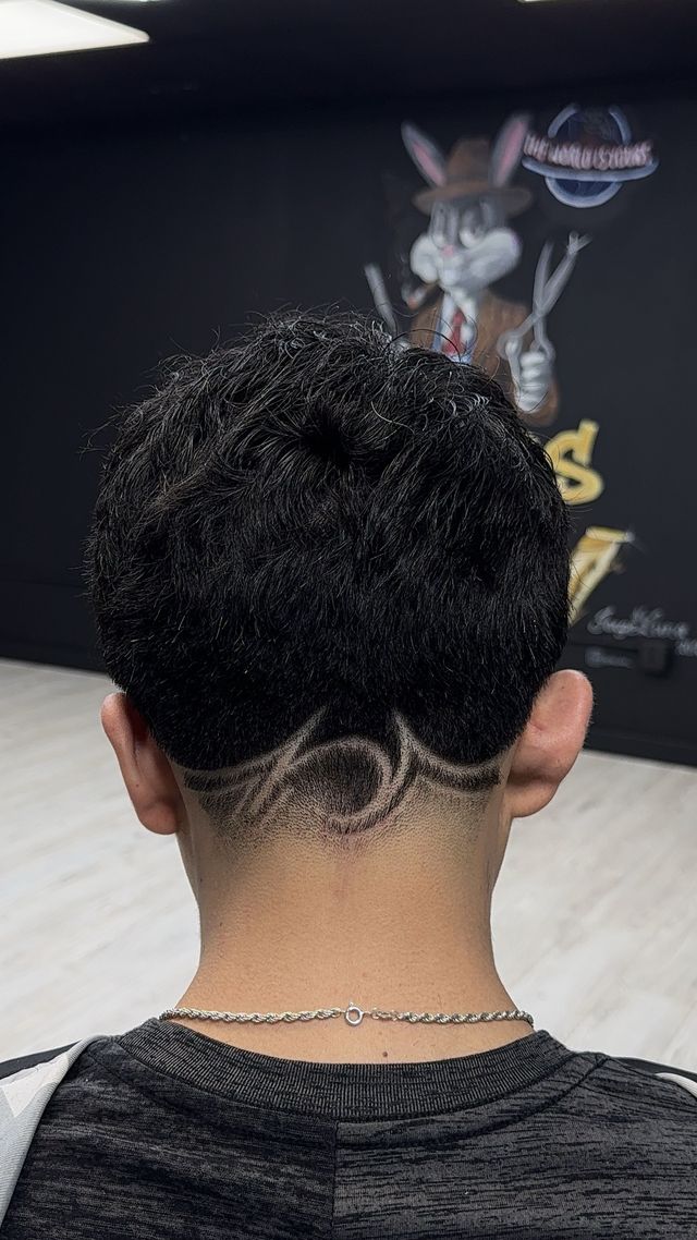Fade with custom hair art design at Masters of da Fade