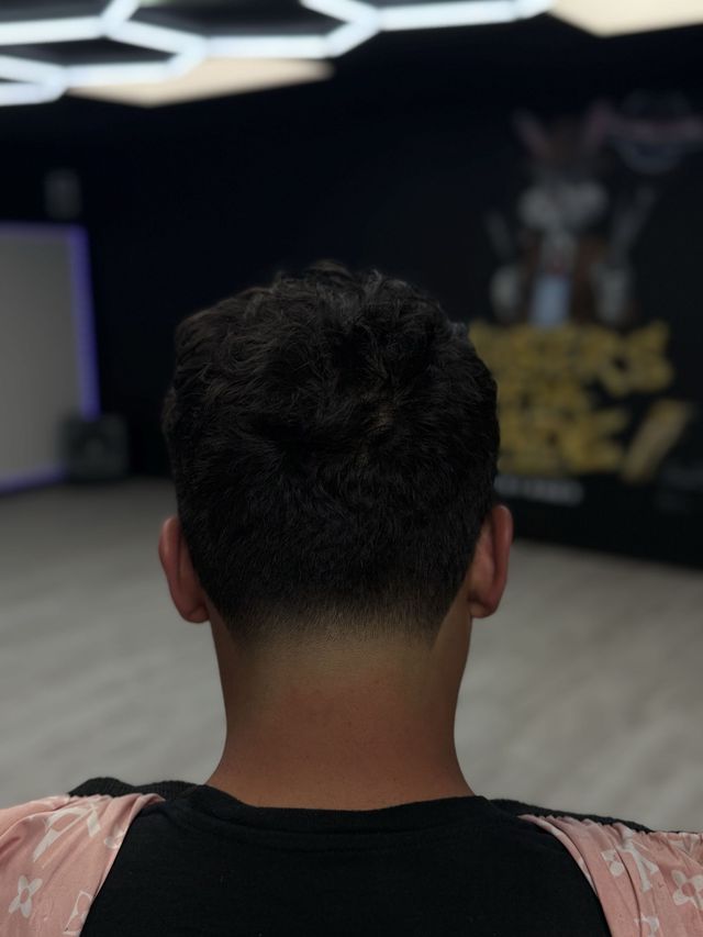 Sharp taper fade with hard part