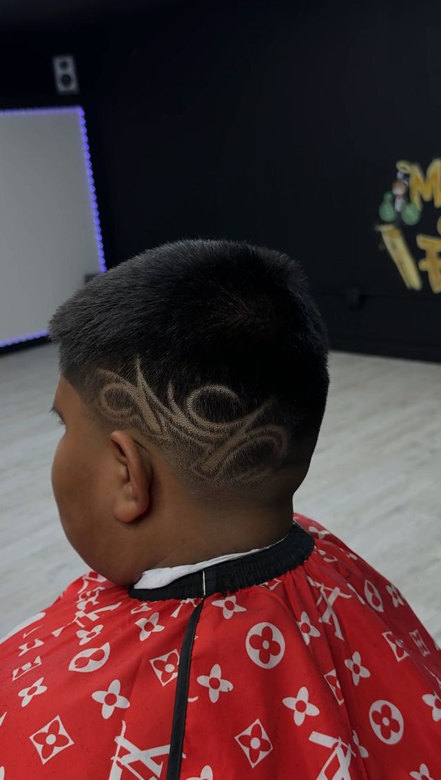 Custom hair art design fade at Masters of da Fade